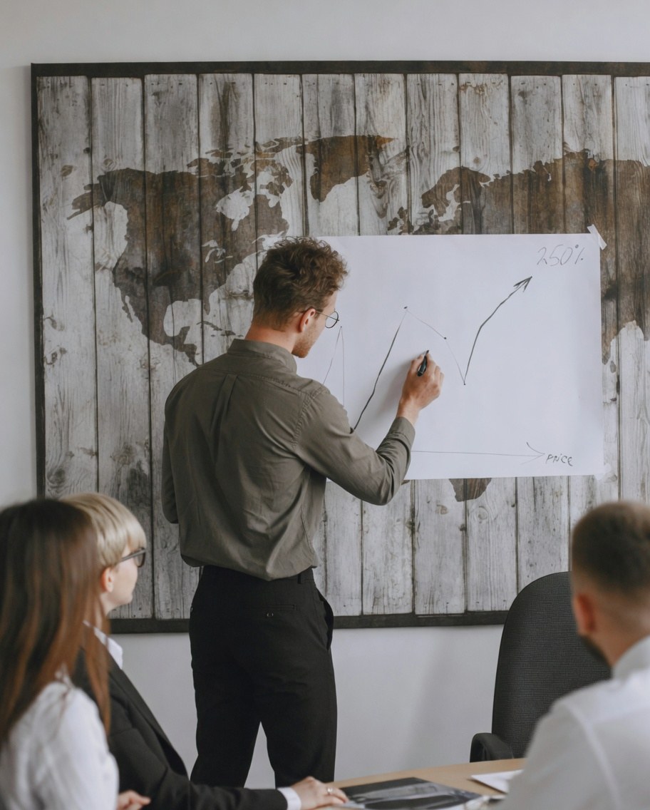 Team reviewing a growth chart on a world map backdrop